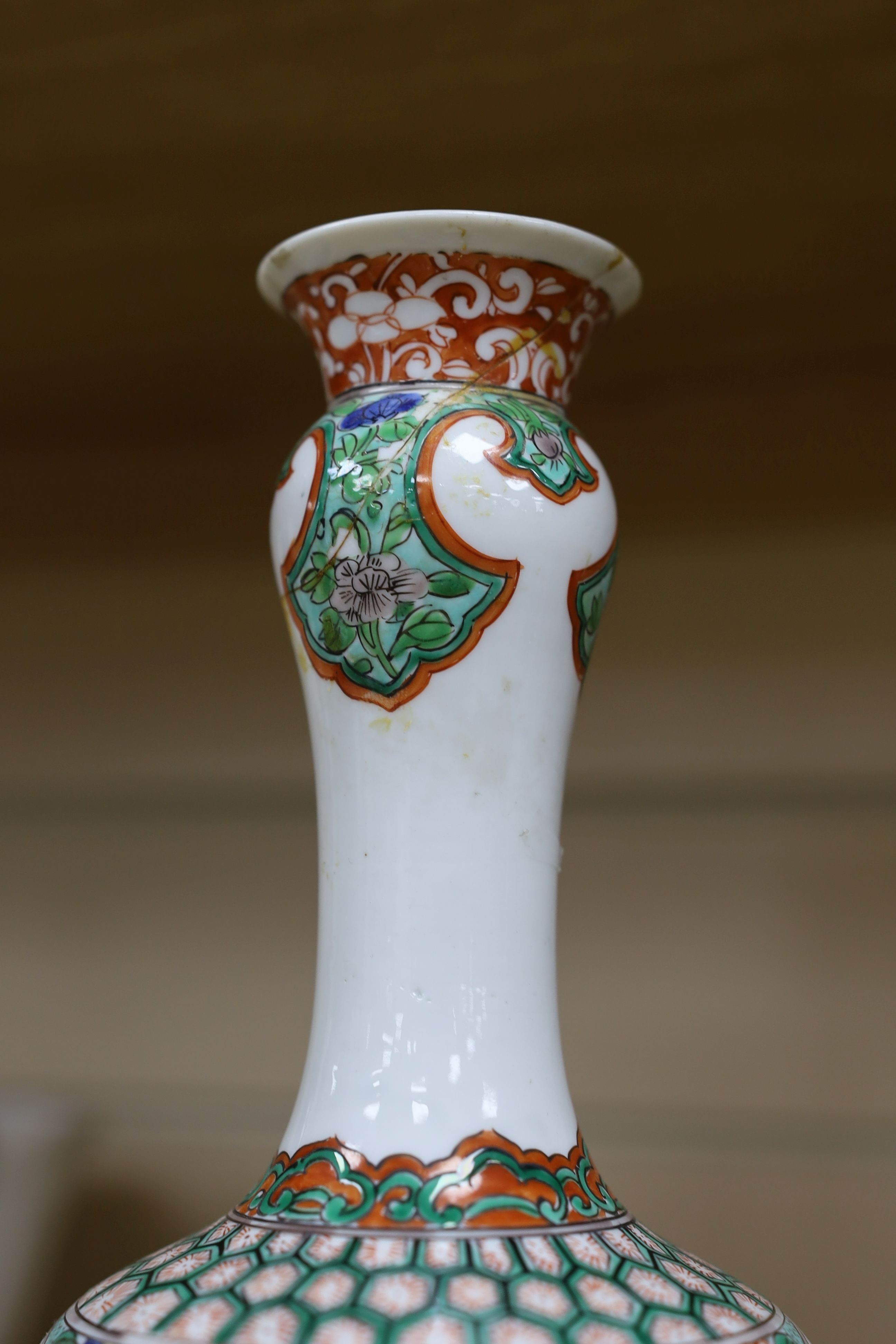 A pair Samson of Paris vases in the Chinese famille verte style and a Chinese Qianlong famille rose garlic neck vase with blue panelling motif, tallest 26cm